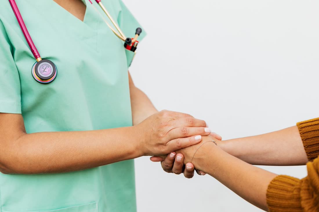 A doctor giving a patient warm, personal, one-on-one attention